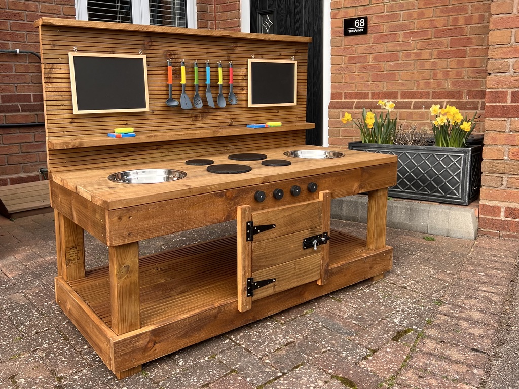 Handmade wooden children's outdoor mud kitchen